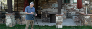 Home Inspector sets up mold testing equipment tools outside.